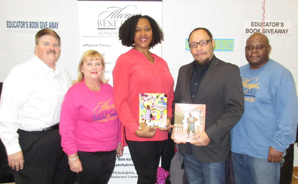  Sharing the pose (from left) are, Joe Clayback, marketing coordinator, Jackie Drinkard, marketing representative, book illustrators Shadra Strickland and Floyd Cooper and Will Childers, operations manager